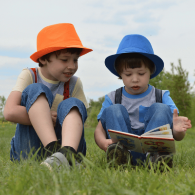 Joyful Journeys Led By The Child – Boys Reading a book 600 x 600 px